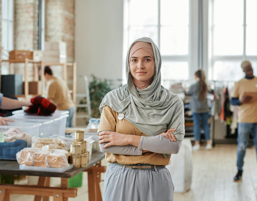 Photo by Ron Lach Women in red shirt tired with hands to closed eyes.